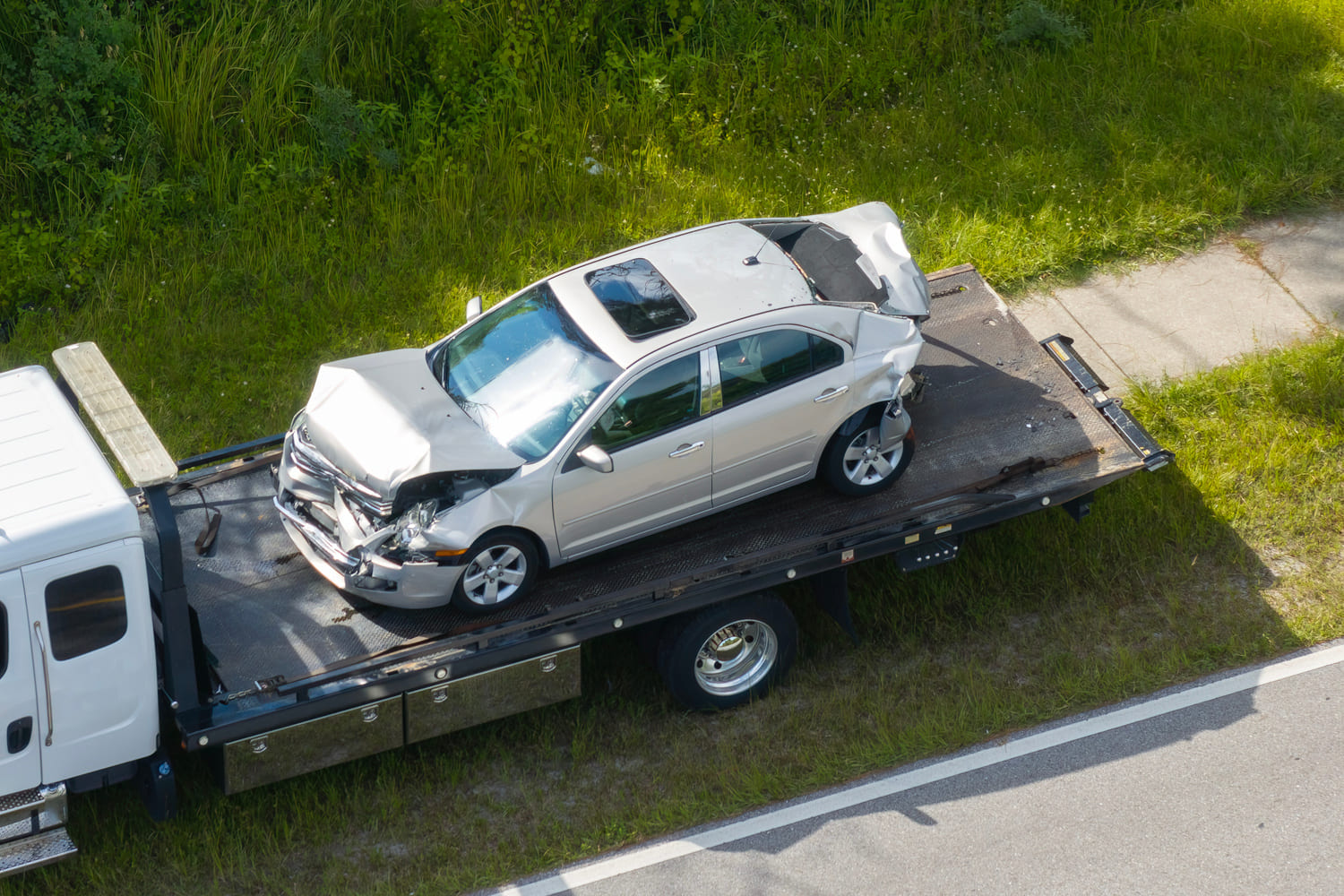 Car being towed after scrap car sale